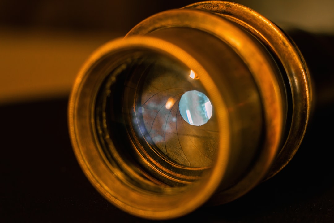 Close-up of a camera lens glass element, the kind of surface where fungus spots can appear